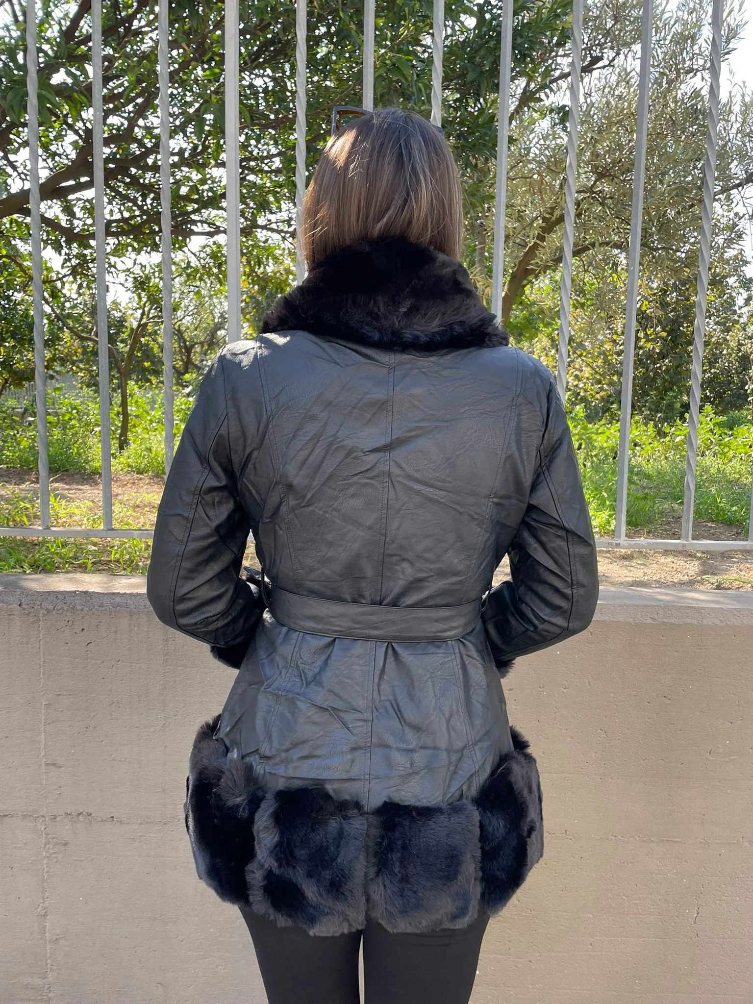 Black eco fur coat with belt.