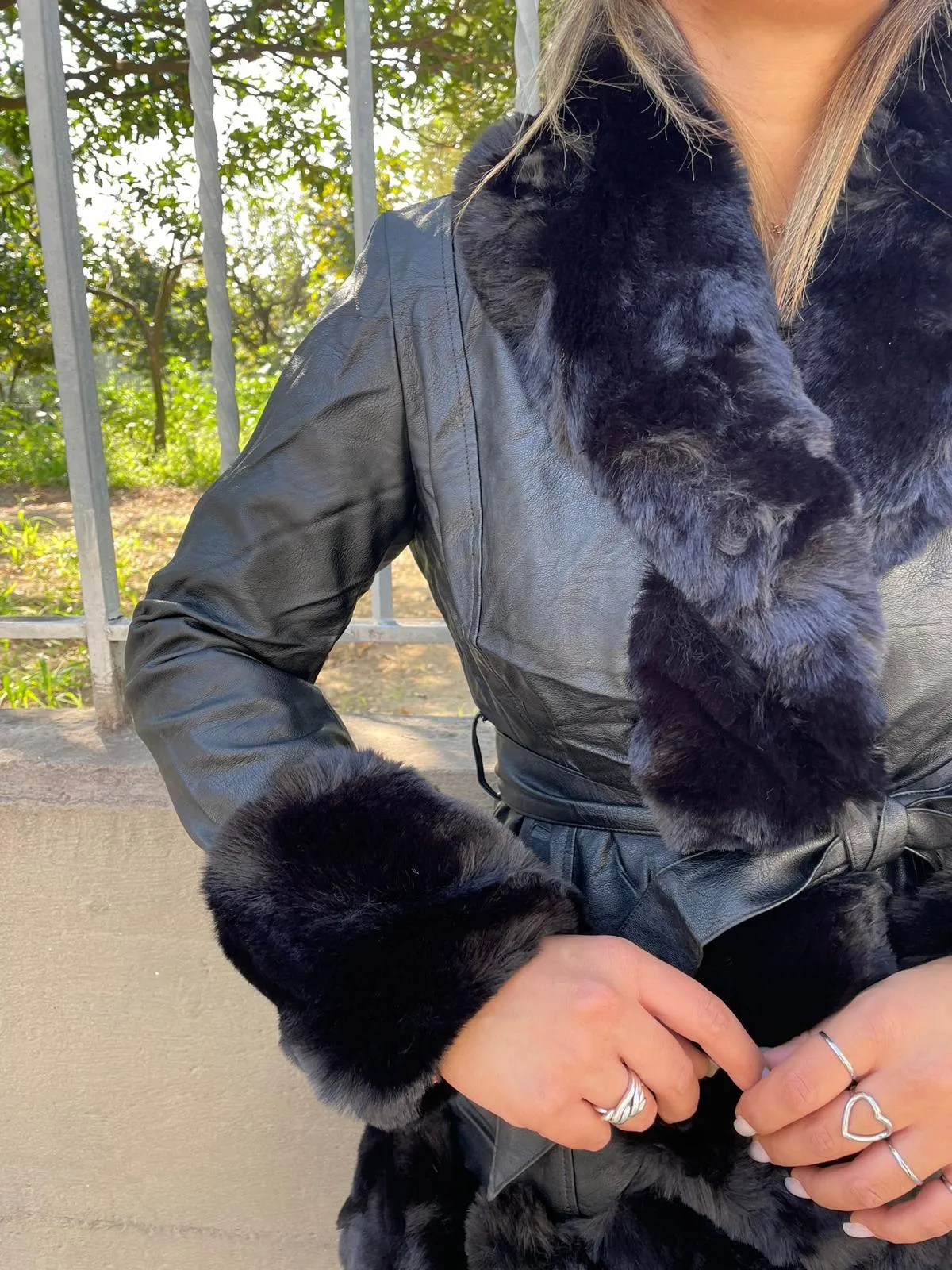 Black eco fur coat with belt.