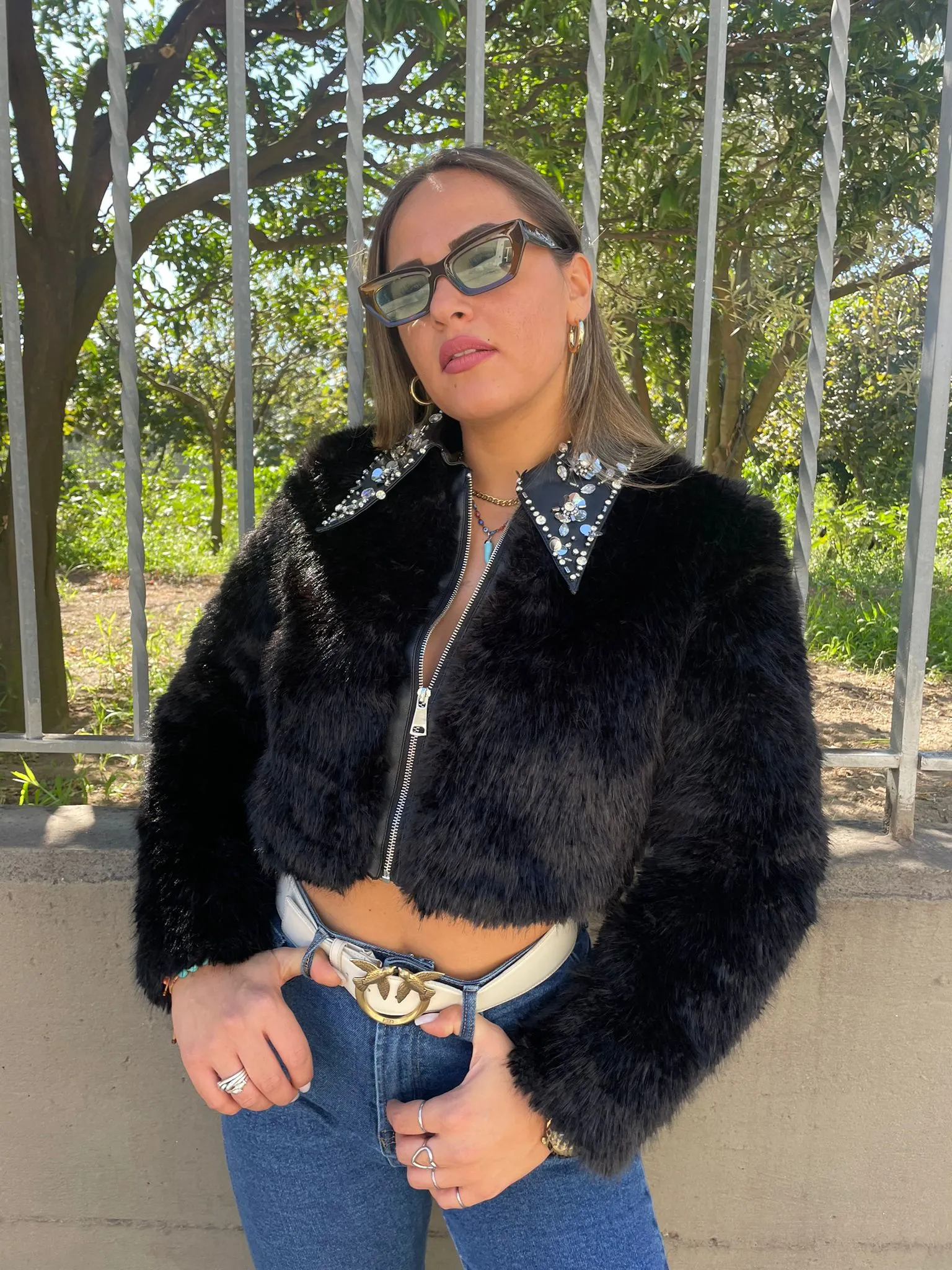 Black faux fur jacket with zip and Swarovski on the collar.