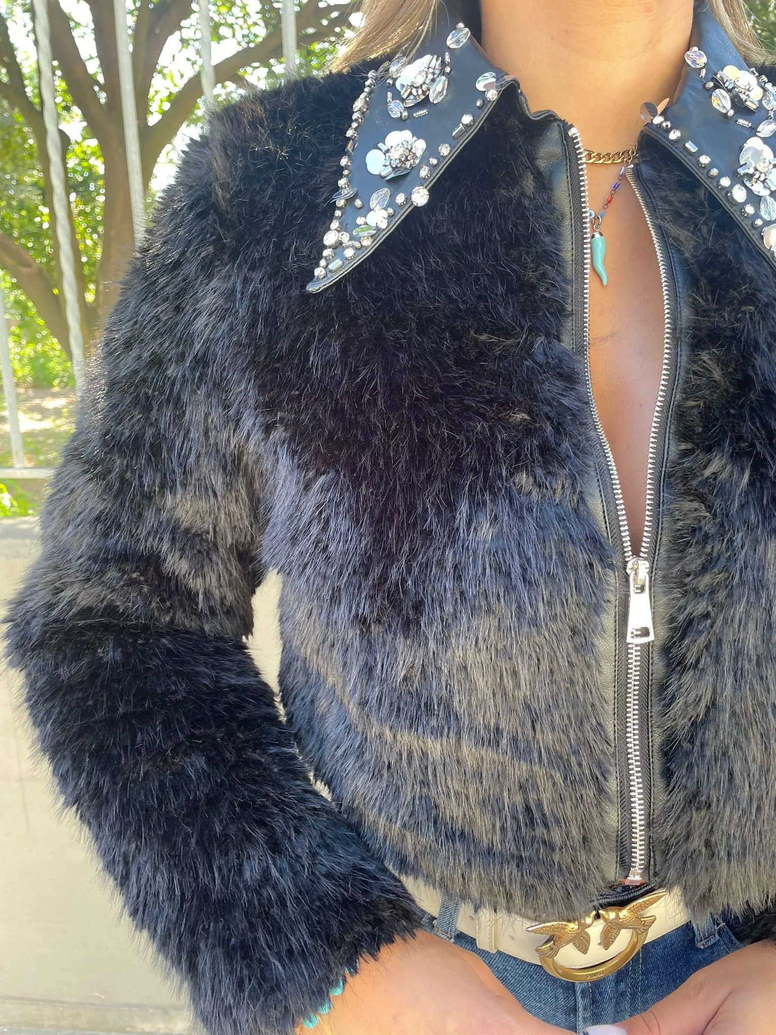 Black faux fur jacket with zip and Swarovski on the collar.