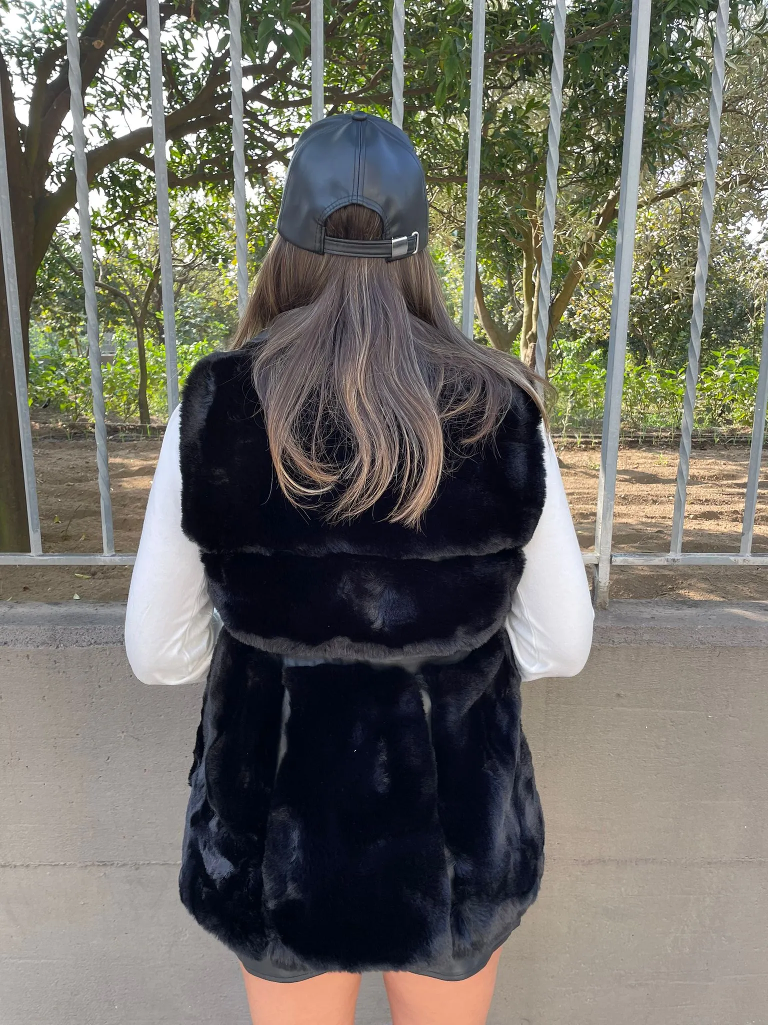 Black sleeveless eco fur jacket
