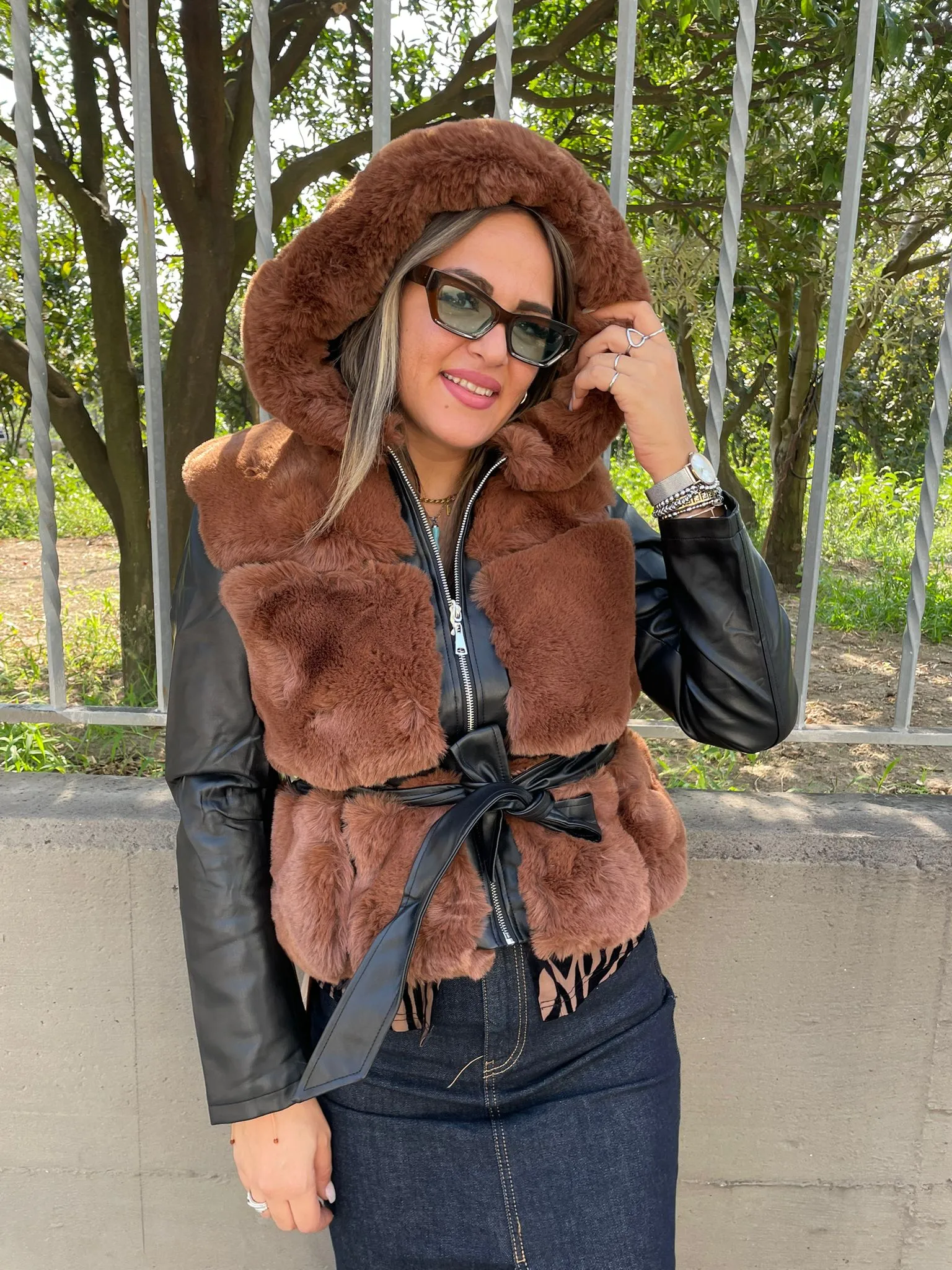 Brown Fur coat with faux leather sleeves.