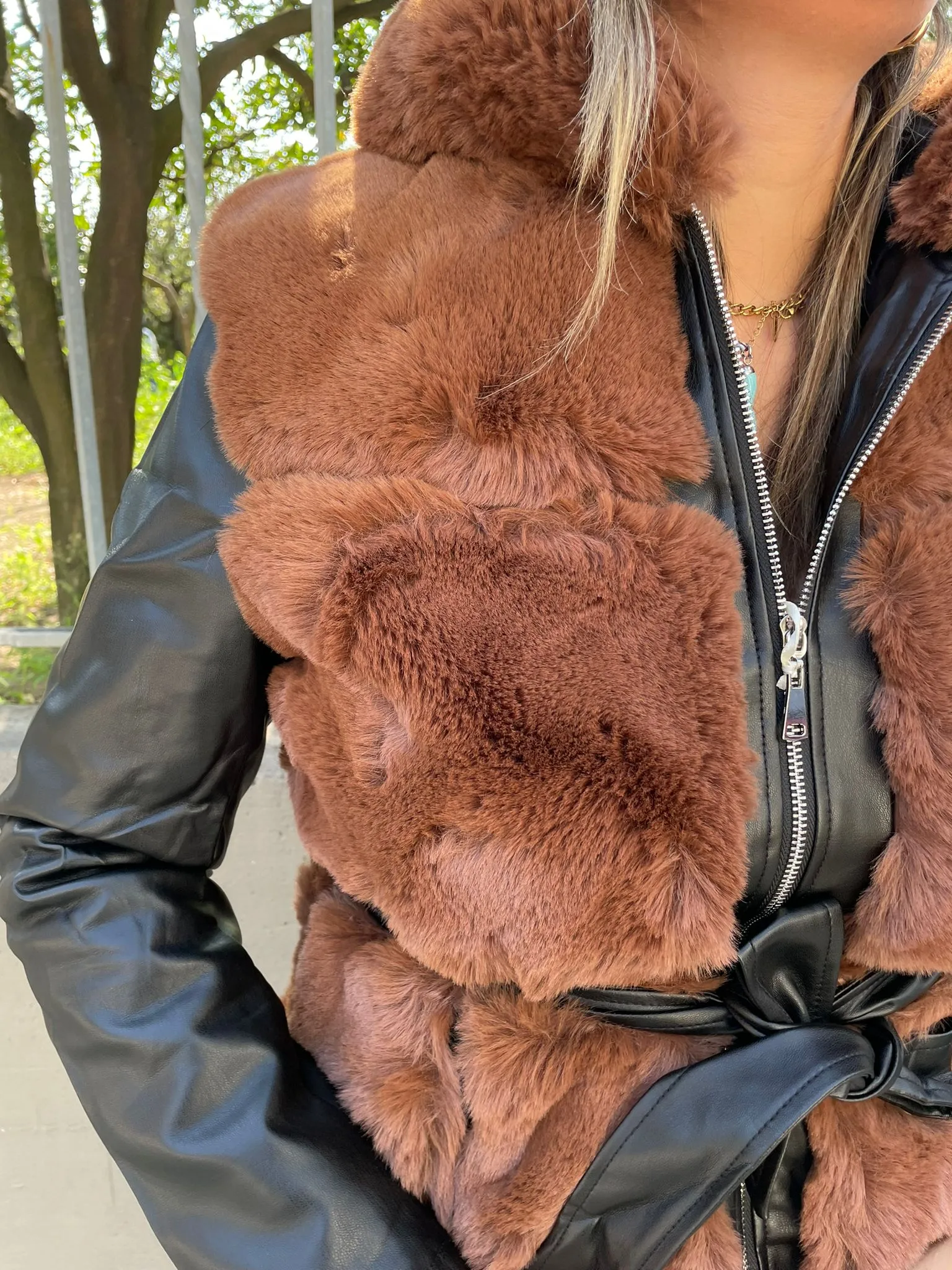 Brown Fur coat with faux leather sleeves.