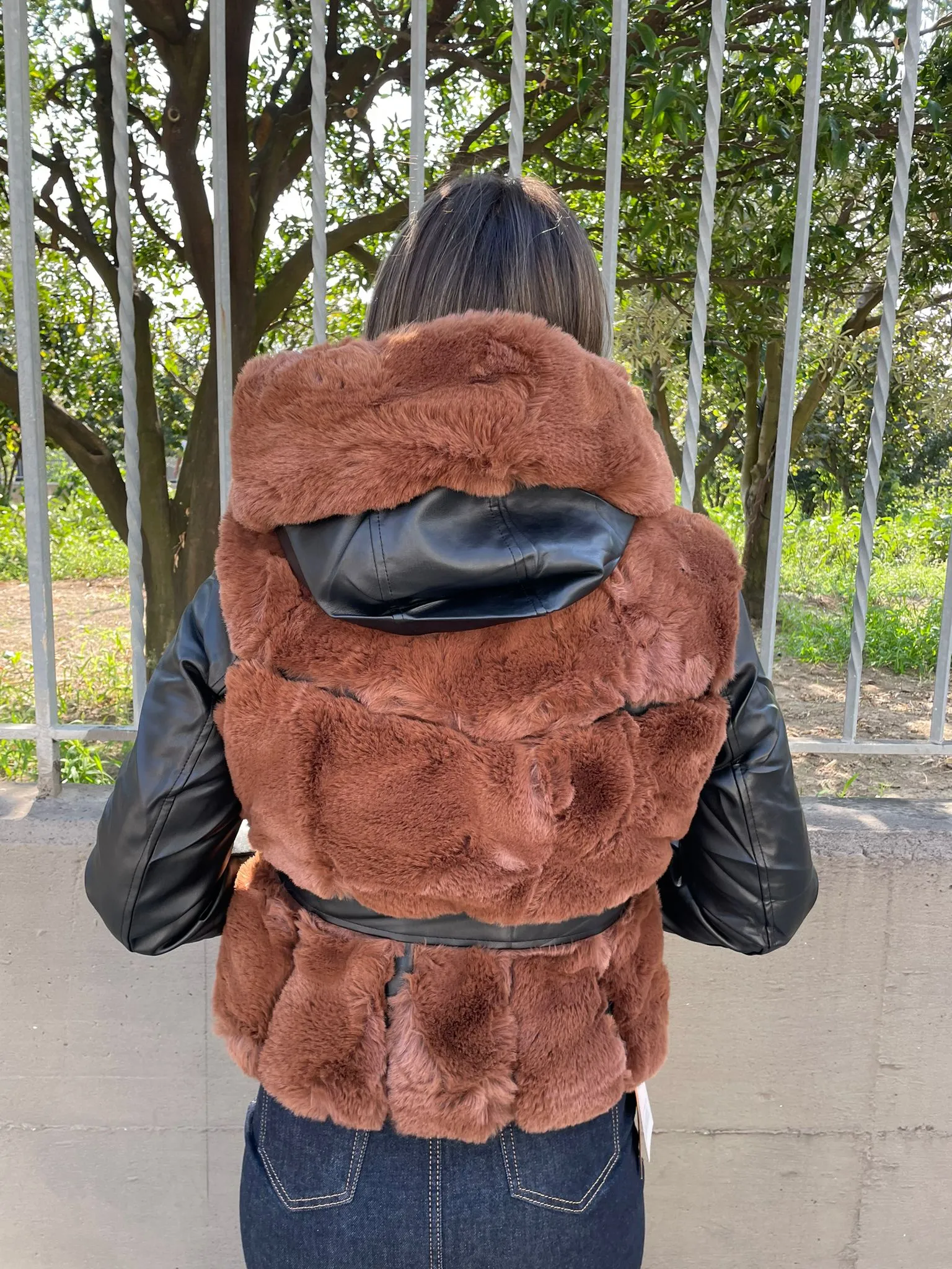 Brown Fur coat with faux leather sleeves.