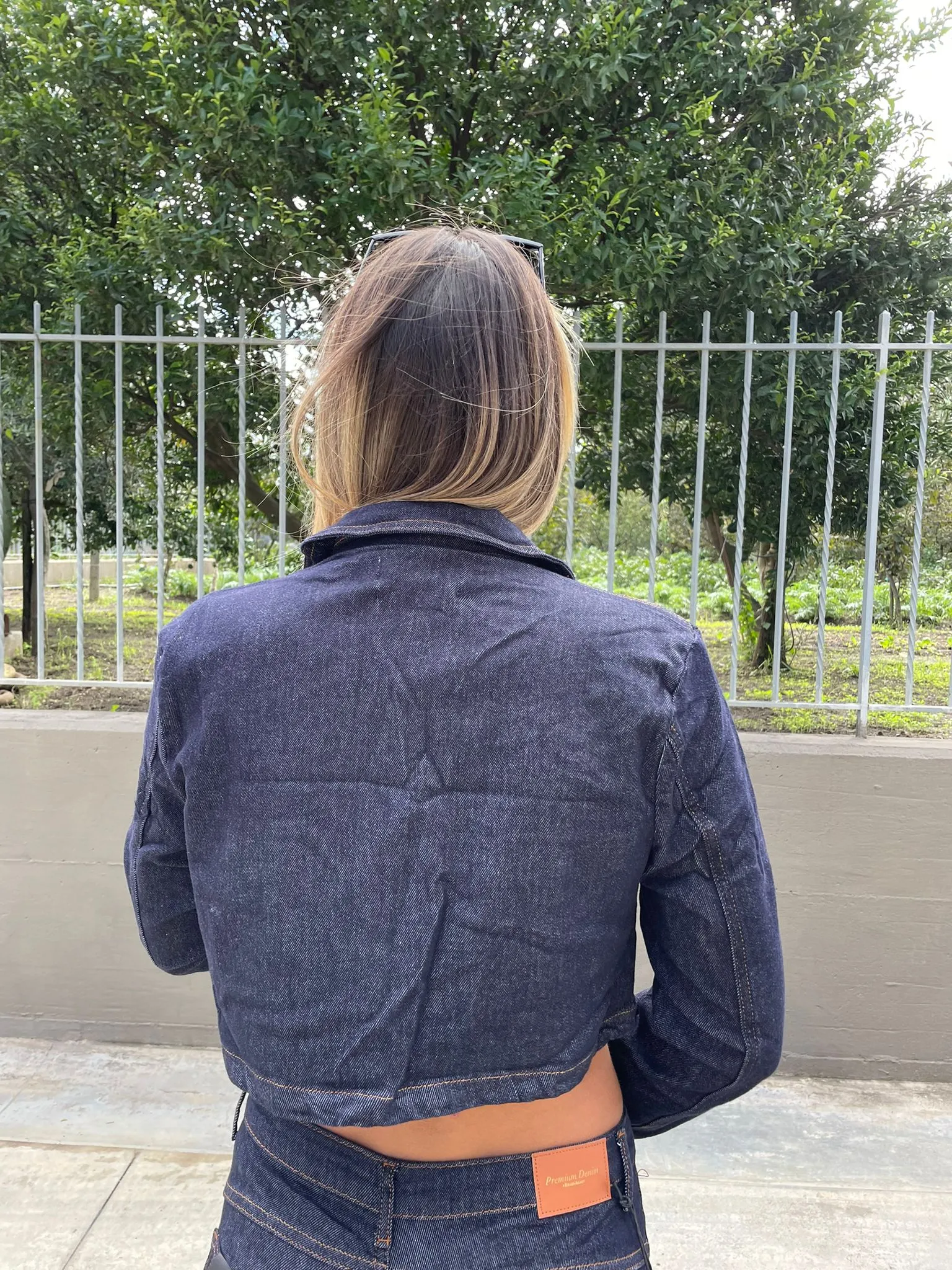 Dark-wash denim blazer.