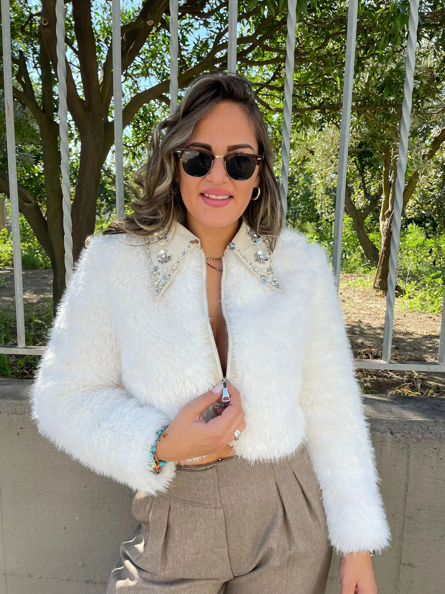 Faux fur jacket with Swarovski zip at the collar.