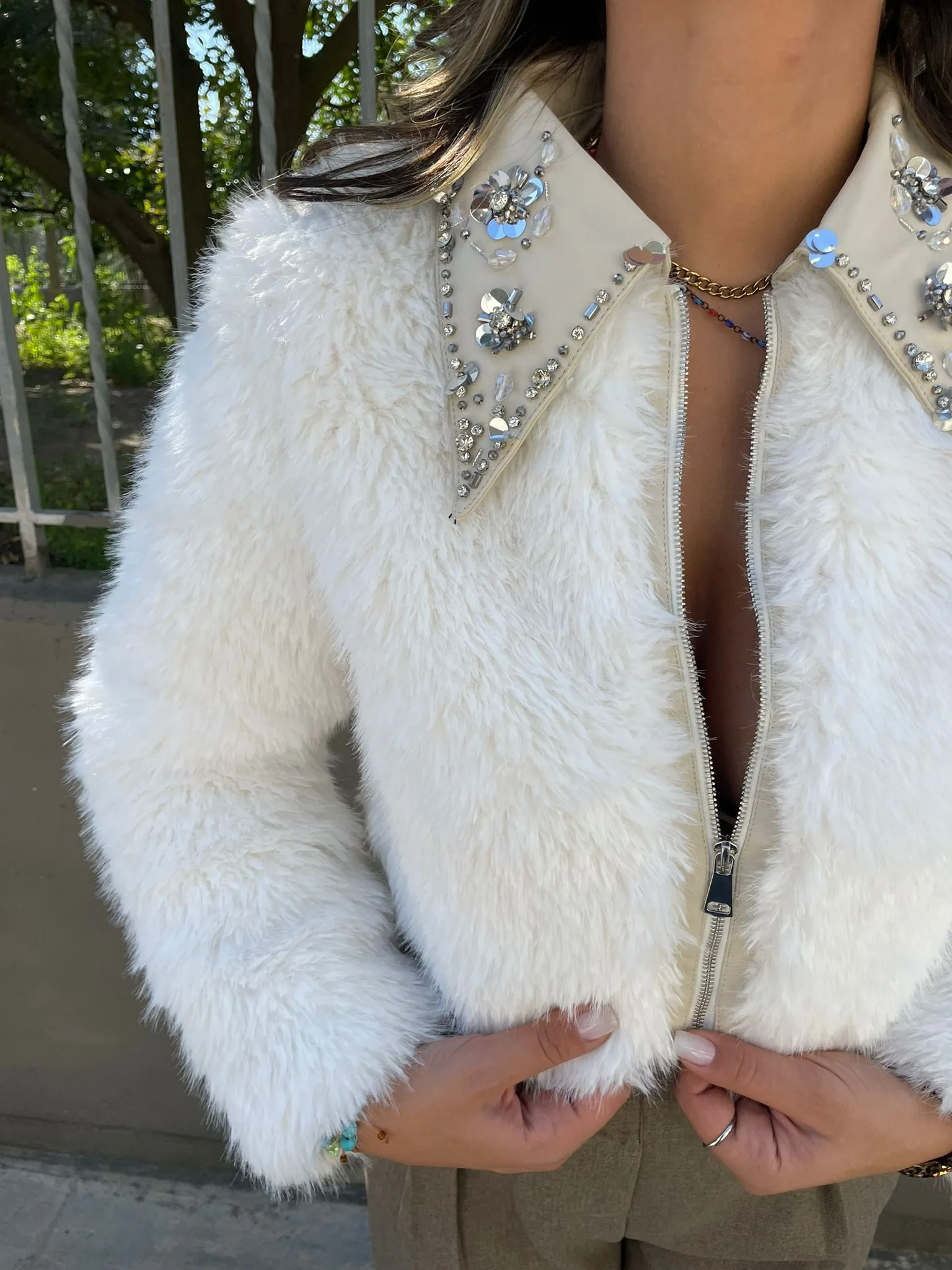 Faux fur jacket with Swarovski zip at the collar.