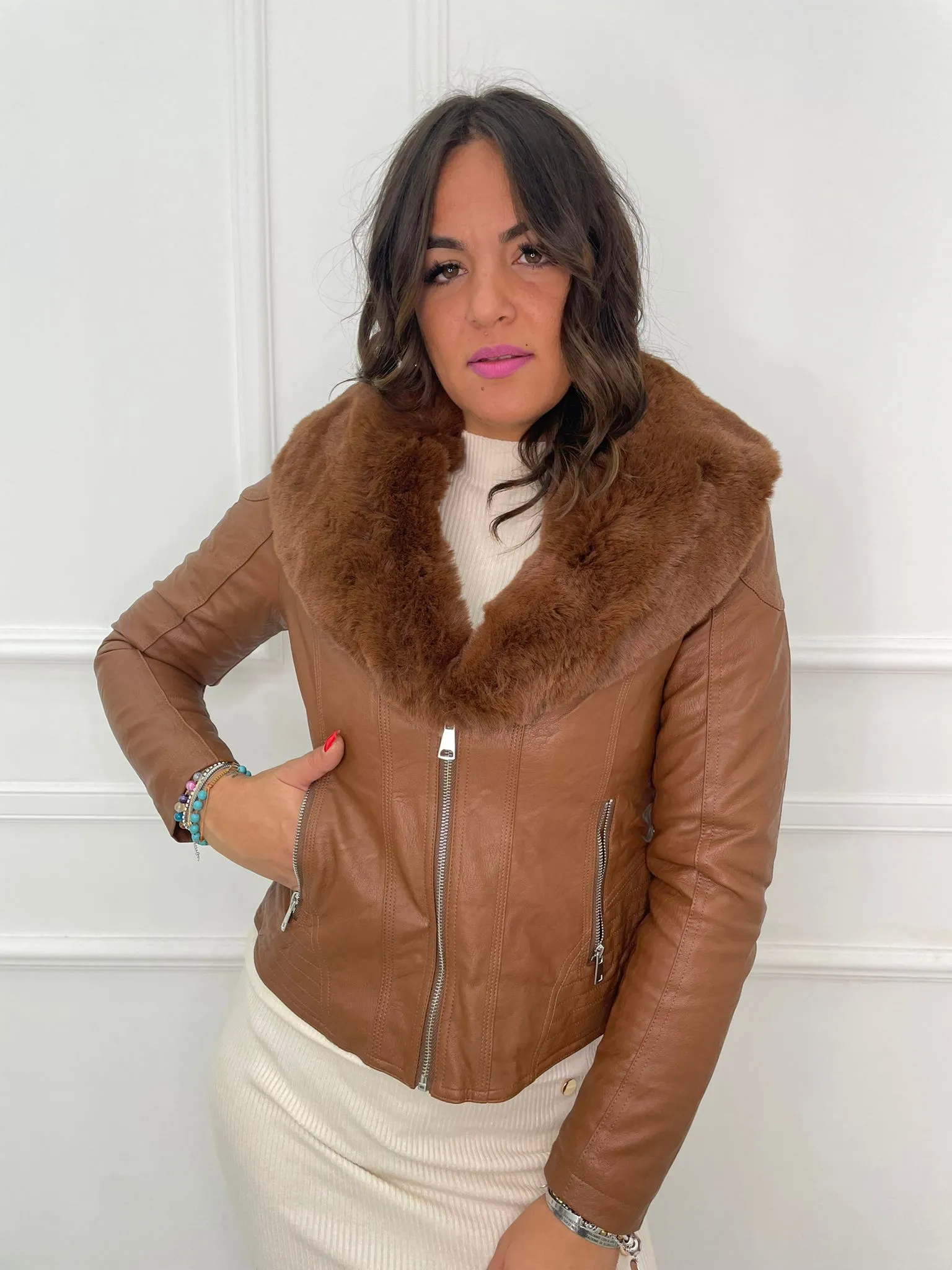 Faux leather jacket with faux fur collar.