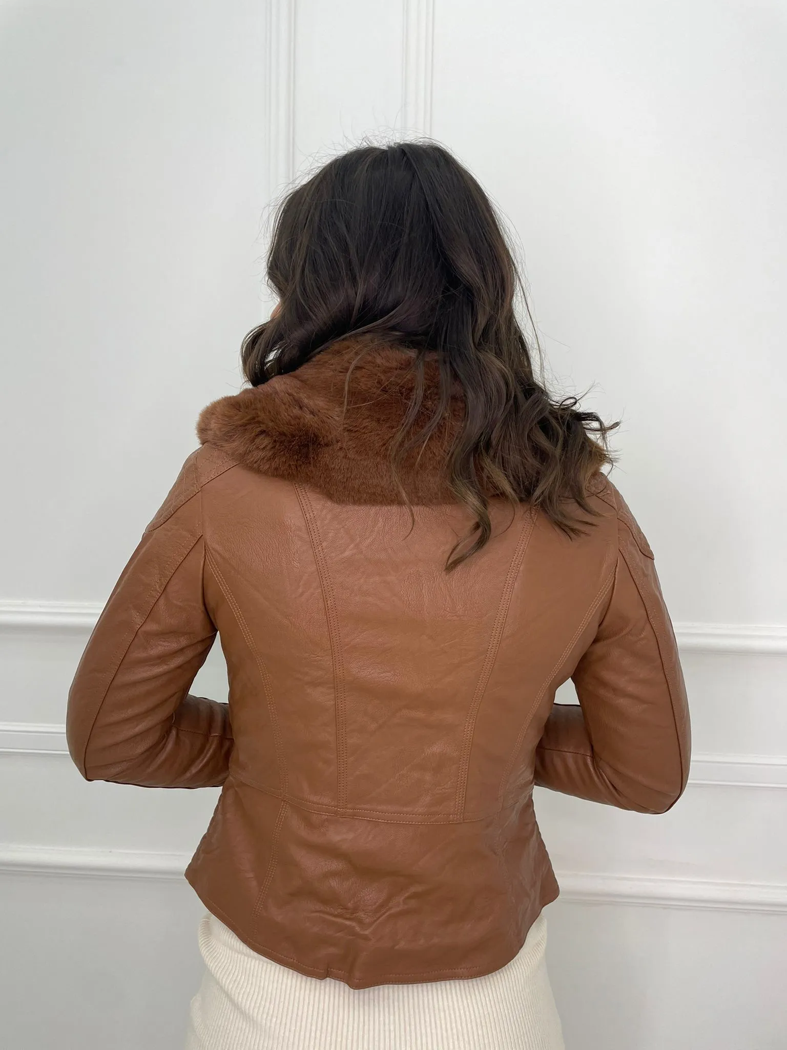 Faux leather jacket with faux fur collar.
