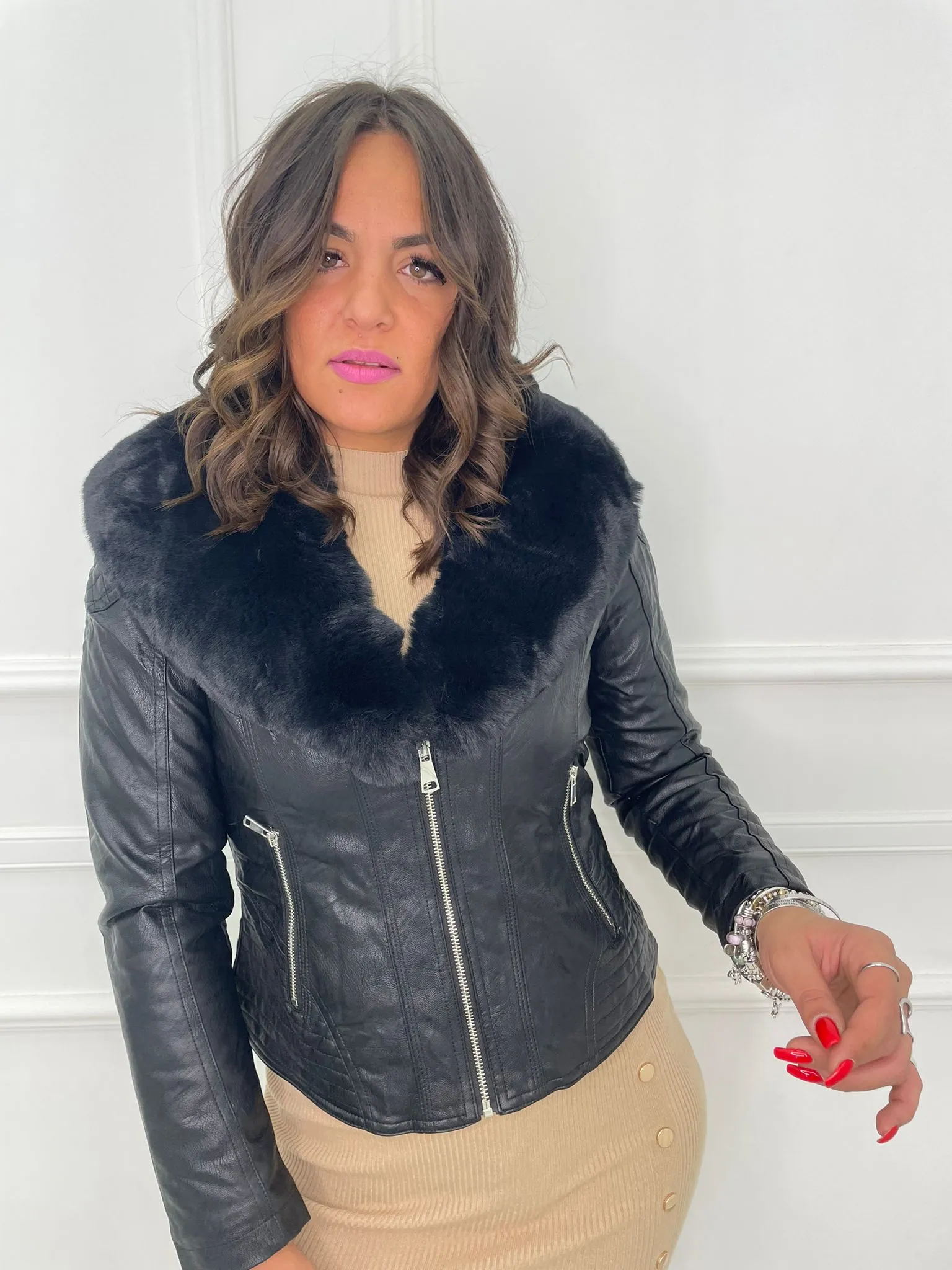 Faux leather jacket with faux fur collar.