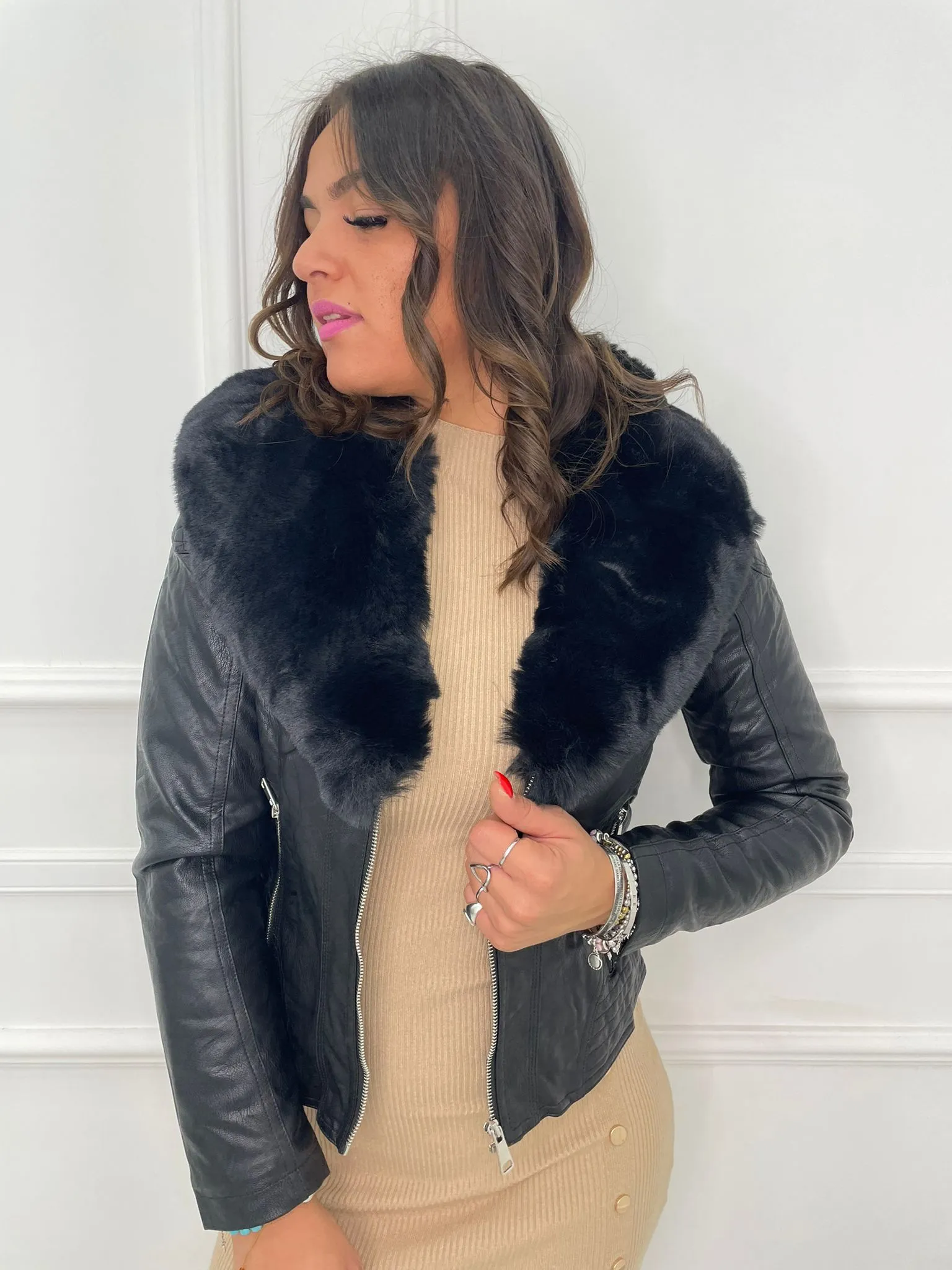 Faux leather jacket with faux fur collar.