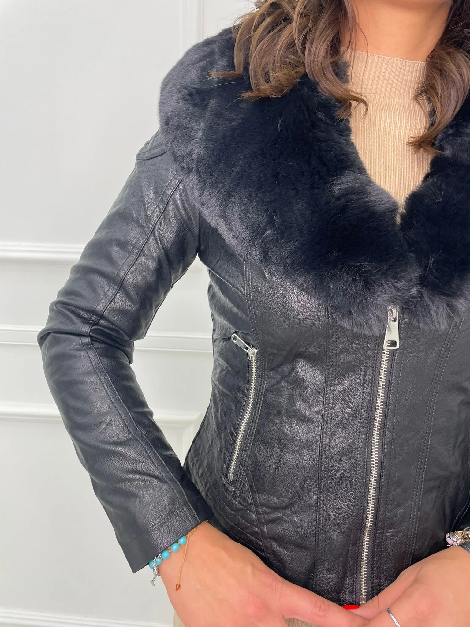 Faux leather jacket with faux fur collar.