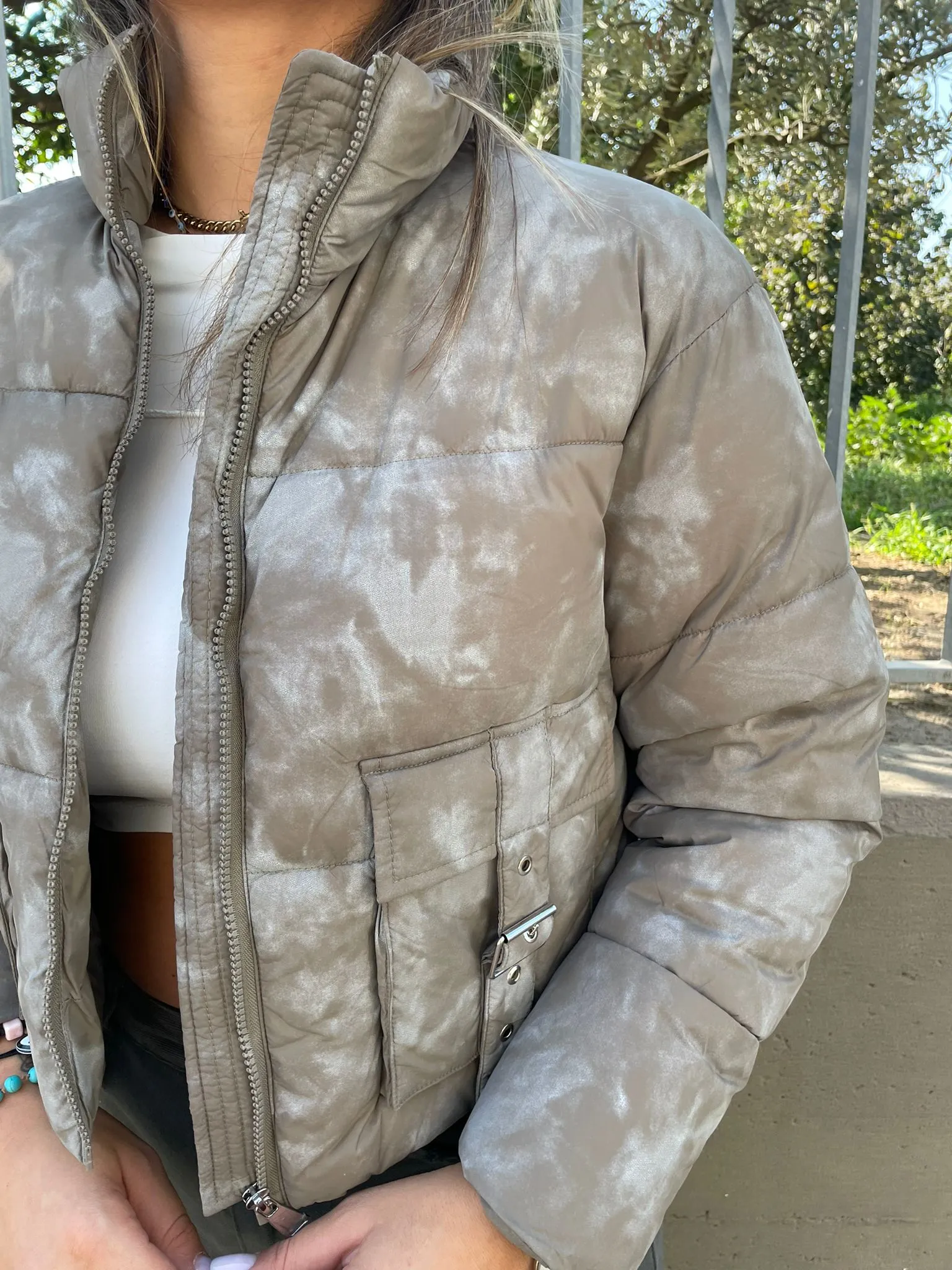 Short green faded bomber jacket with pockets.