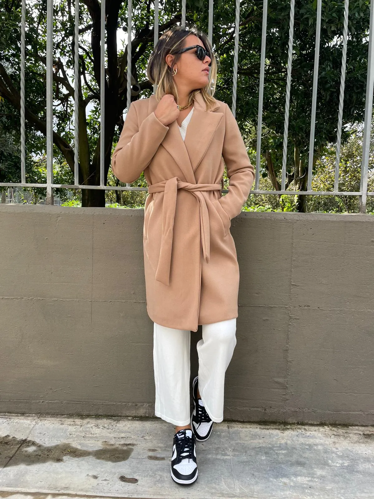 Solid color coat with belt.
