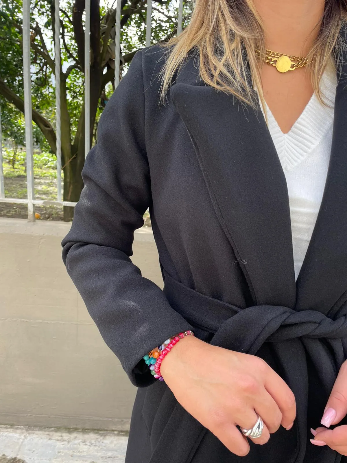 Solid color coat with belt.