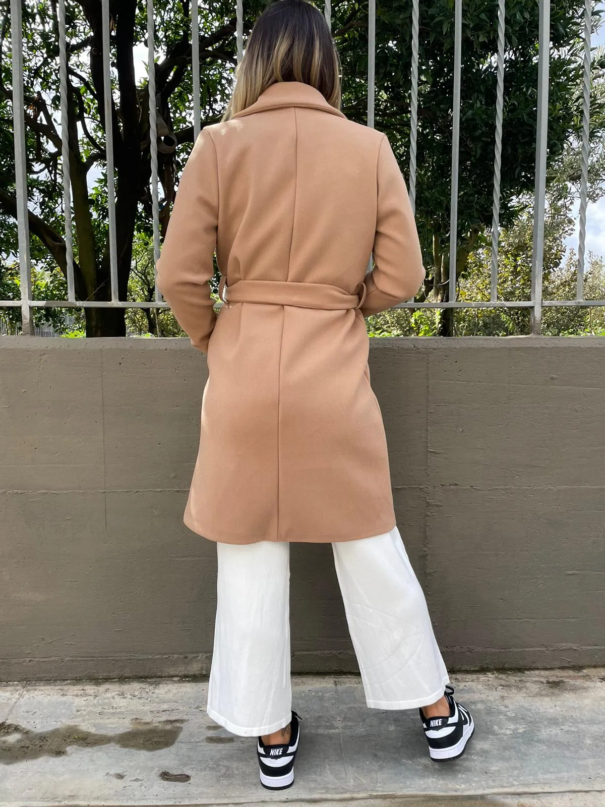 Solid color coat with belt.