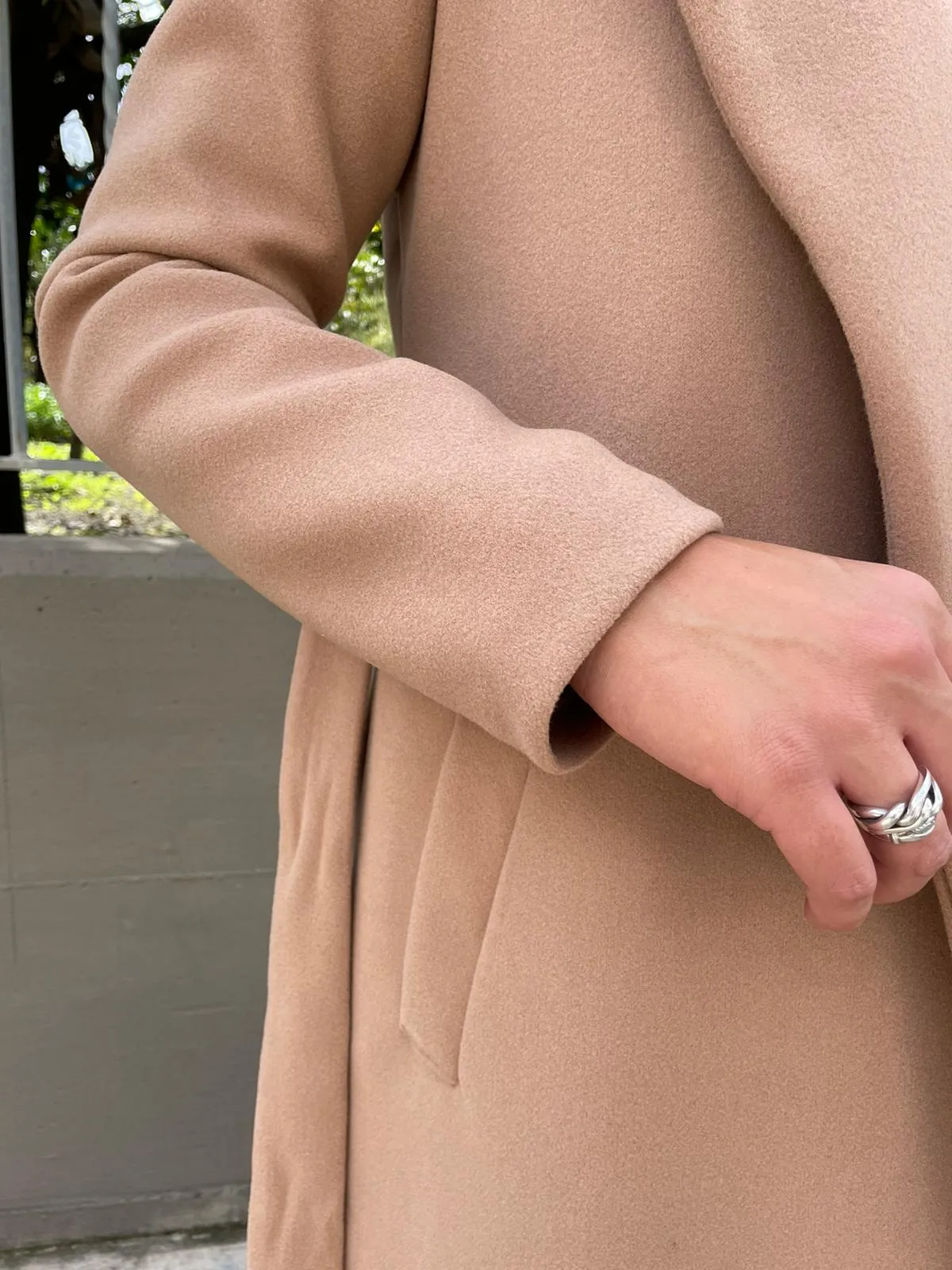 Solid color coat with belt.