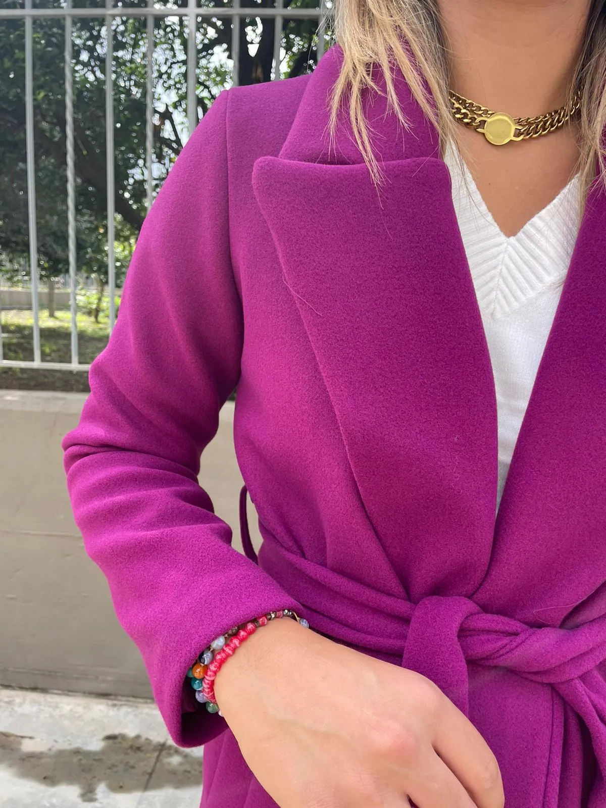 Solid color coat with belt.